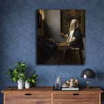 Woman Holding a Balance by Johannes Vermeer